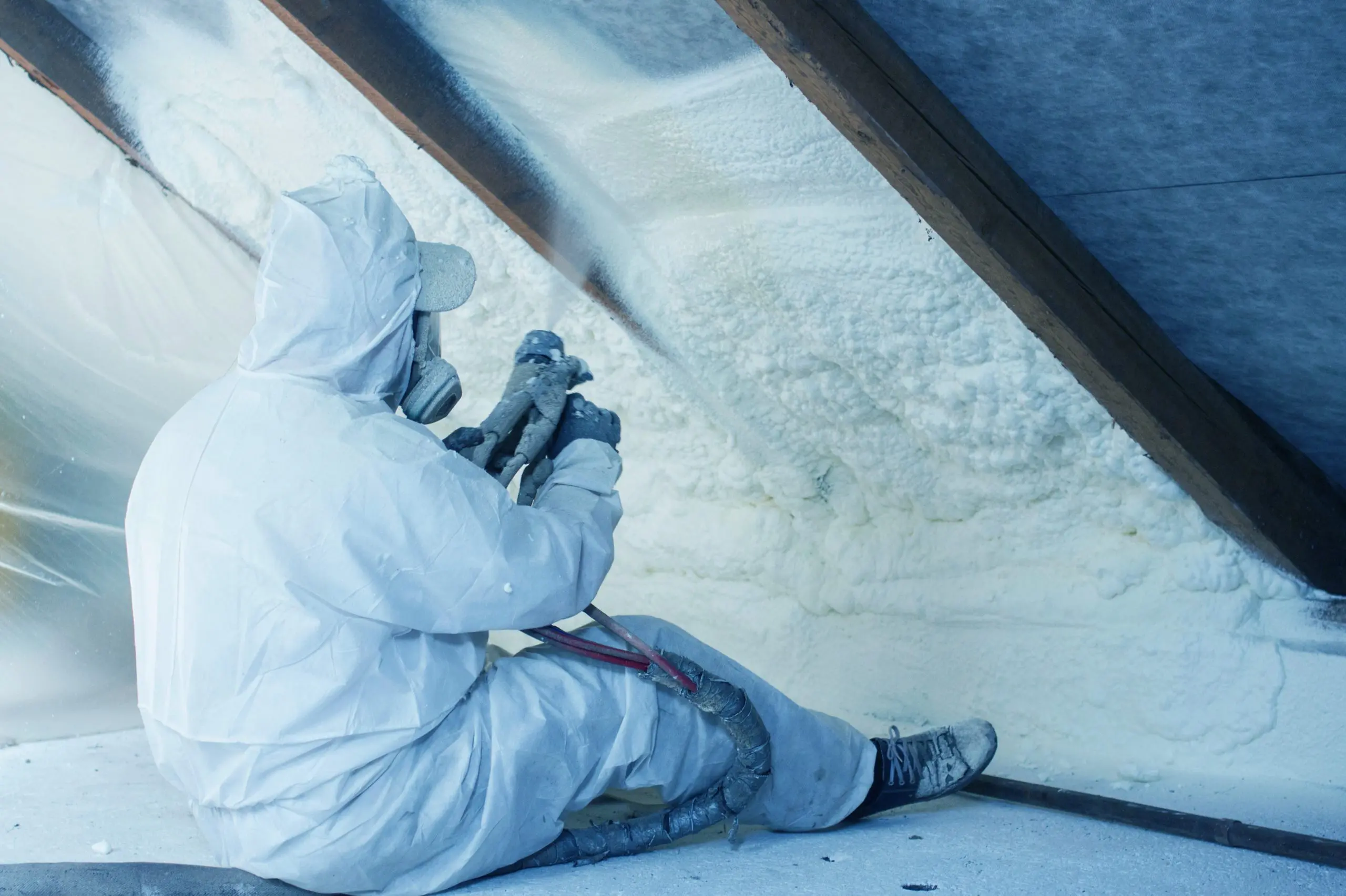 contractor performing spray foam insulation services